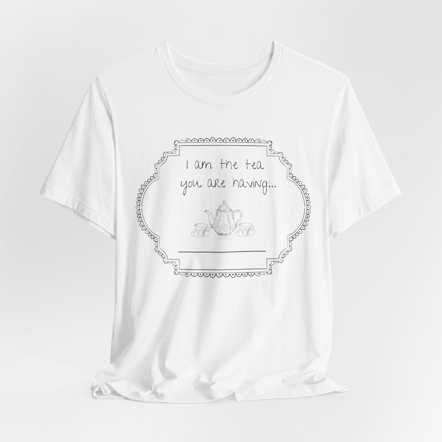 White t-shirt with a graphic and text on a light gray studio background
