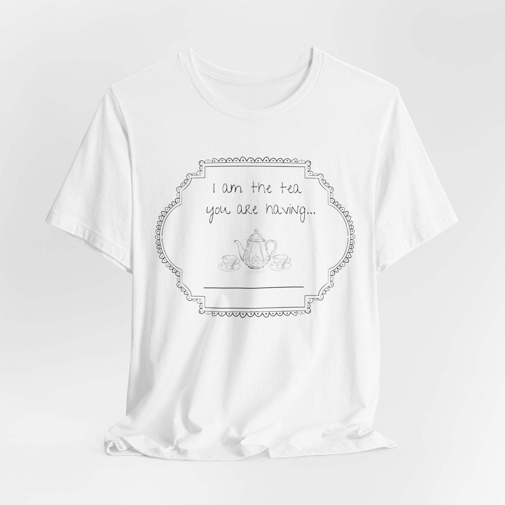 White t-shirt with a graphic and text on a light gray studio background