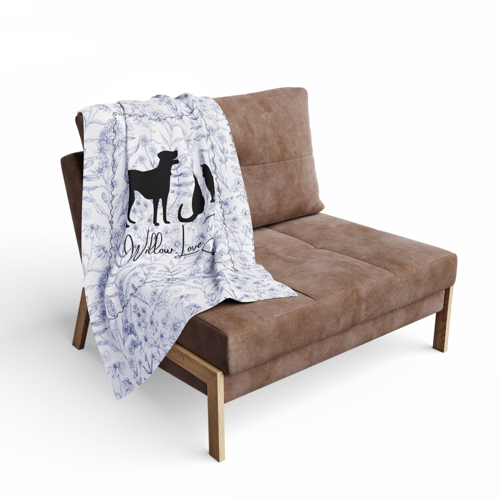 Smaller blanket on a Brown sofa with  featuring dog and cats illustrations on a white background