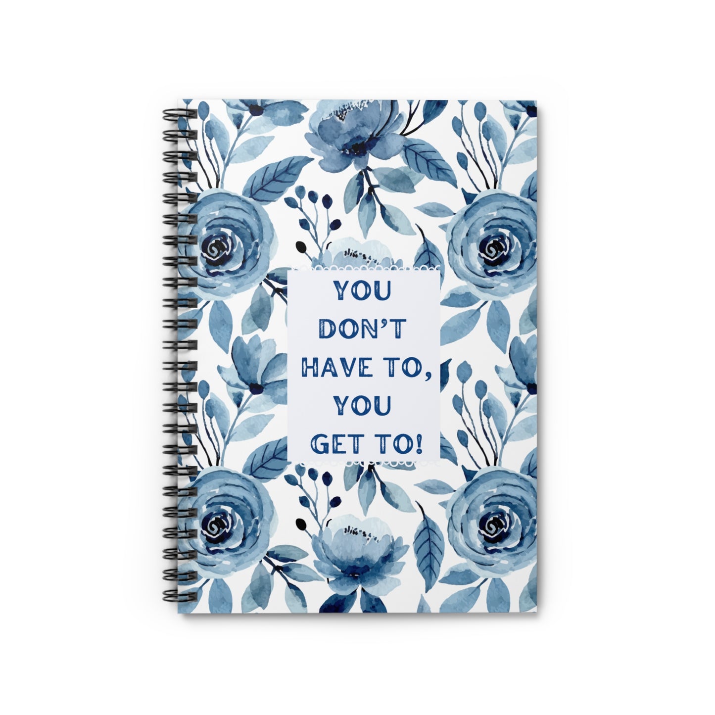 Front over view of notebook with blue floral design and motivational quote on a white background
