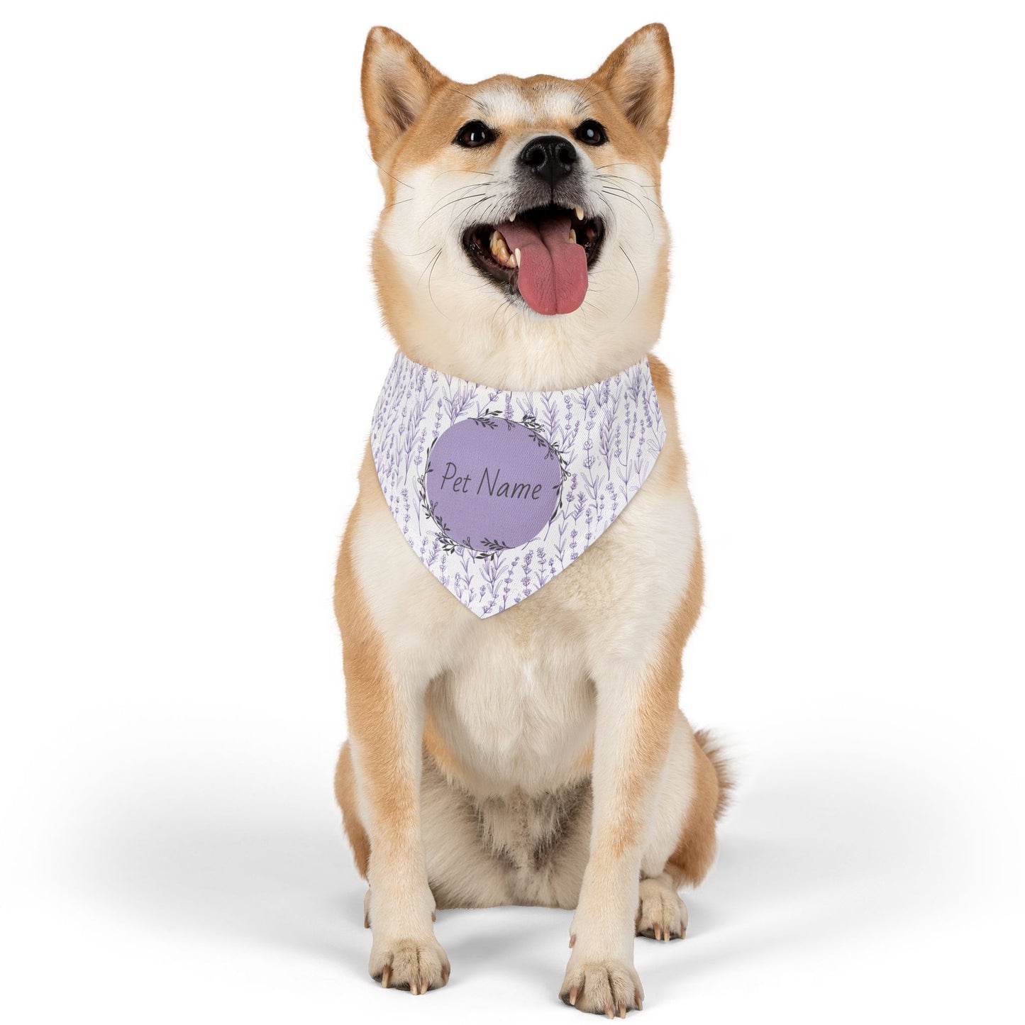 Dog wearing a bandana with a customizable name tag on a white background