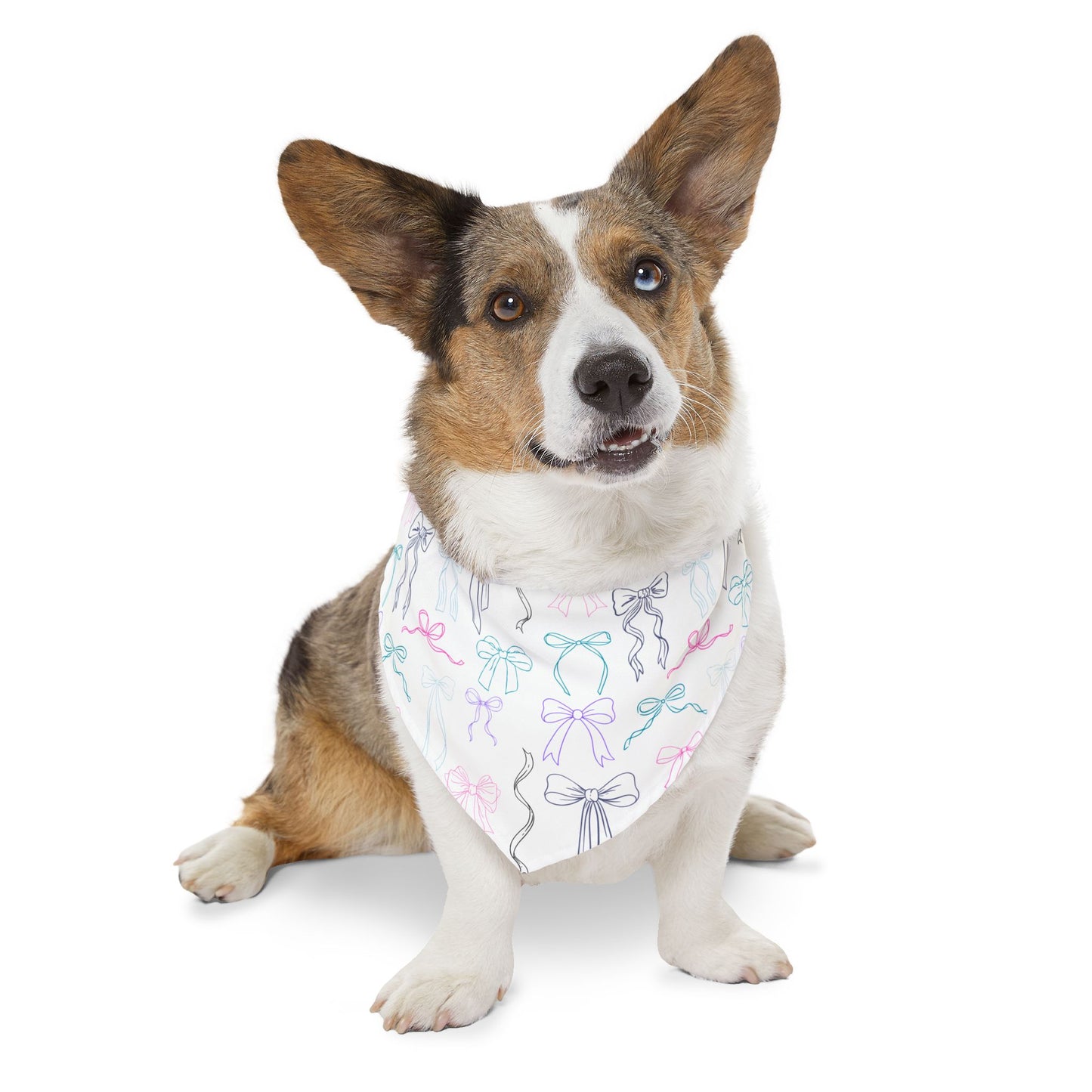 Dog wearing a bandana with bow print on a white background