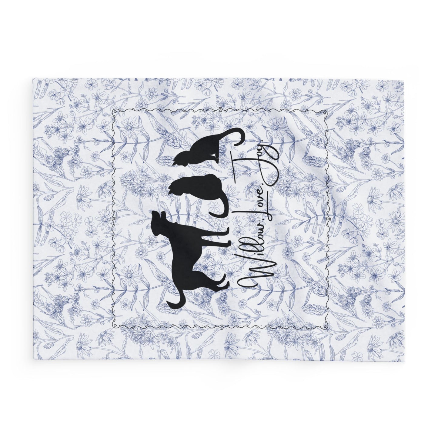 Side view of smaller size Floral Print blanket with a silhouette of a dog and two cats, featuring the text 'Willow Love Joy'. 