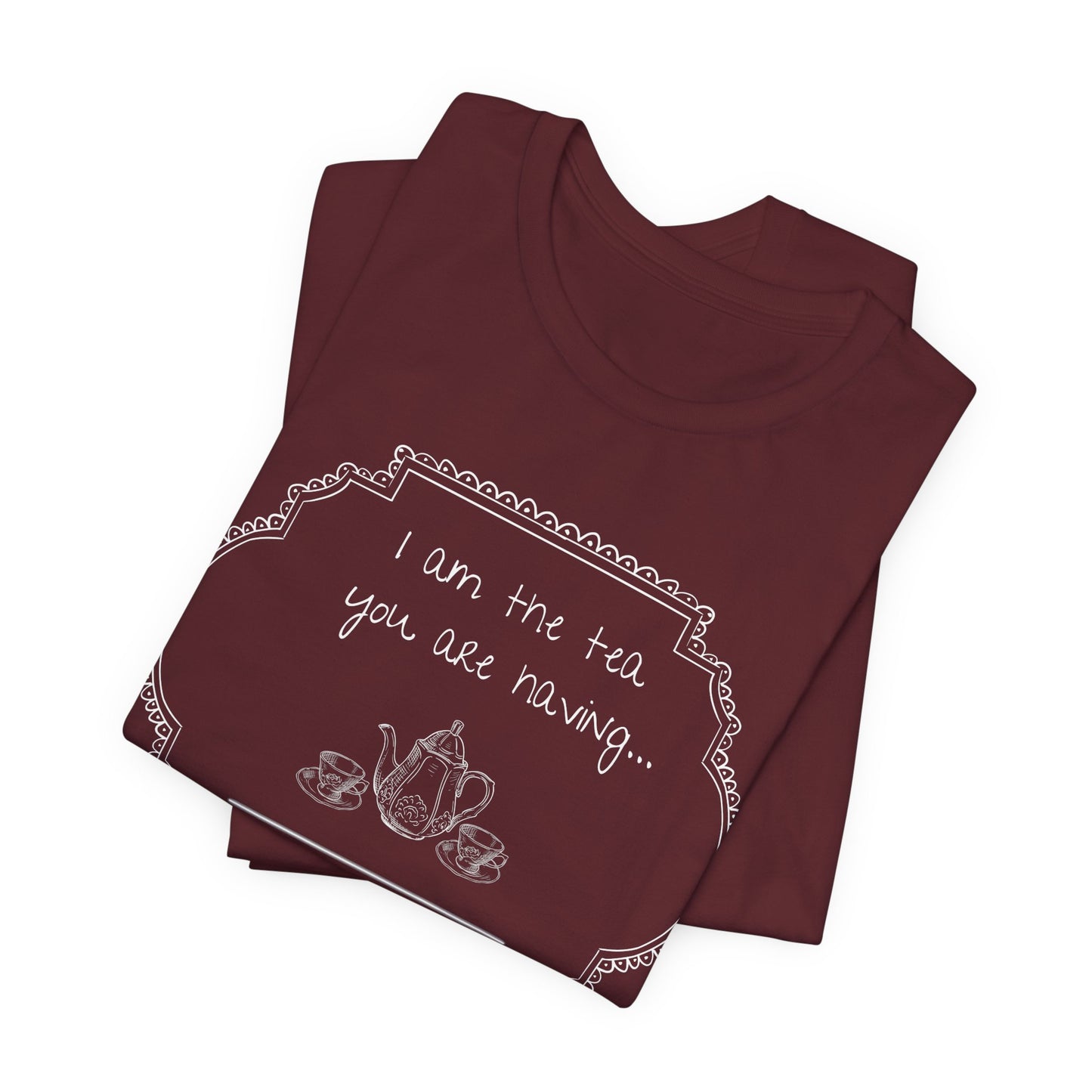 Two maroon t-shirts stacked on a white background